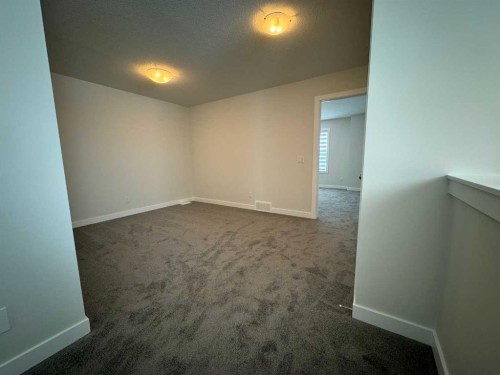 150 Edith Green Nw, Calgary, AB - Indoor Photo Showing Other Room