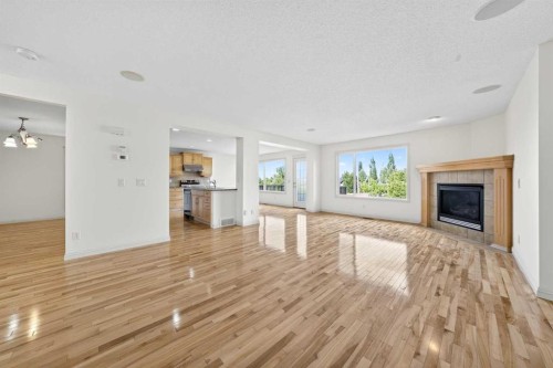 320 Everbrook Way Sw, Calgary, AB - Indoor Photo Showing Living Room With Fireplace
