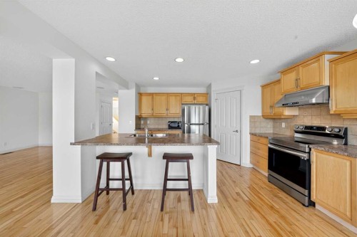 320 Everbrook Way Sw, Calgary, AB - Indoor Photo Showing Kitchen With Stainless Steel Kitchen With Double Sink