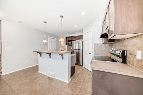 104 Country Village Lane Ne, Calgary, AB - Indoor Photo Showing Kitchen With Stainless Steel Kitchen