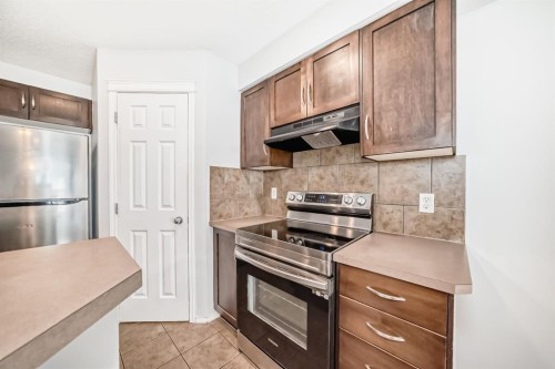 104 Country Village Lane Ne, Calgary, AB - Indoor Photo Showing Kitchen With Stainless Steel Kitchen