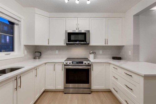 605-474 Seton Circle Se, Calgary, AB - Indoor Photo Showing Kitchen With Upgraded Kitchen