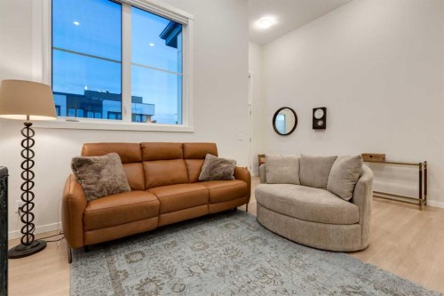 605-474 Seton Circle Se, Calgary, AB - Indoor Photo Showing Living Room