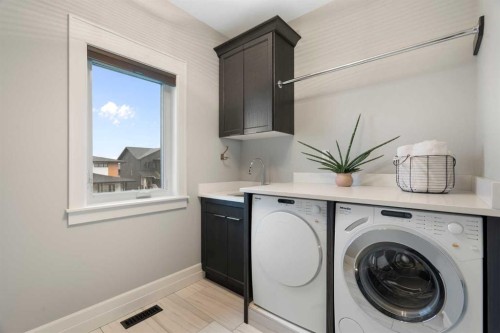 30 Dunes Drive, Desert Blume, AB - Indoor Photo Showing Laundry Room