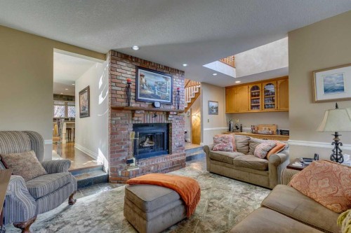 1302 Frontenac Avenue Sw, Calgary, AB - Indoor Photo Showing Living Room With Fireplace