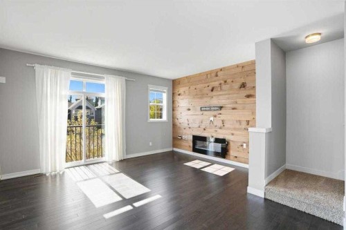 22 Nolan Hill Gate Nw, Calgary, AB - Indoor Photo Showing Living Room With Fireplace