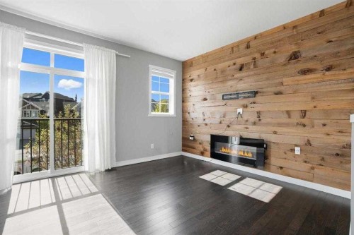 22 Nolan Hill Gate Nw, Calgary, AB - Indoor Photo Showing Living Room With Fireplace