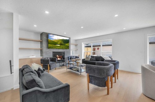4239 Vauxhall Crescent Nw, Calgary, AB - Indoor Photo Showing Living Room With Fireplace