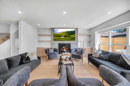 4239 Vauxhall Crescent Nw, Calgary, AB - Indoor Photo Showing Living Room With Fireplace