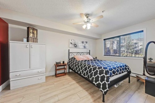 112-380 Marina Drive, Chestermere, AB - Indoor Photo Showing Bedroom