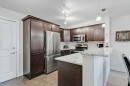 112-380 Marina Drive, Chestermere, AB  - Indoor Photo Showing Kitchen With Stainless Steel Kitchen With Upgraded Kitchen 