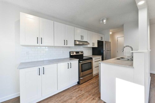 204-2220 16A Street Sw, Calgary, AB - Indoor Photo Showing Kitchen With Stainless Steel Kitchen