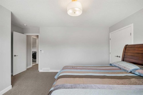 212 Magnolia Heath Se, Calgary, AB - Indoor Photo Showing Bedroom