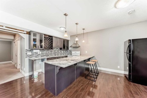 388 Kinniburgh Boulevard, Chestermere, AB - Indoor Photo Showing Kitchen With Upgraded Kitchen