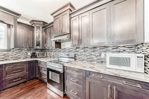 388 Kinniburgh Boulevard, Chestermere, AB - Indoor Photo Showing Kitchen With Upgraded Kitchen
