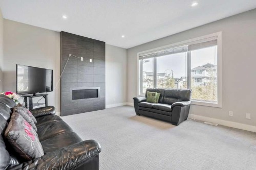 82 Panton View Nw, Calgary, AB - Indoor Photo Showing Living Room With Fireplace