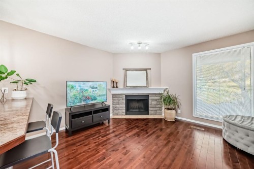 8432 Berkley Road Nw, Calgary, AB - Indoor Photo Showing Living Room With Fireplace