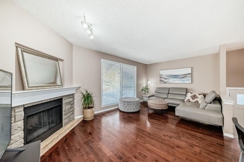 8432 Berkley Road Nw, Calgary, AB - Indoor Photo Showing Living Room With Fireplace