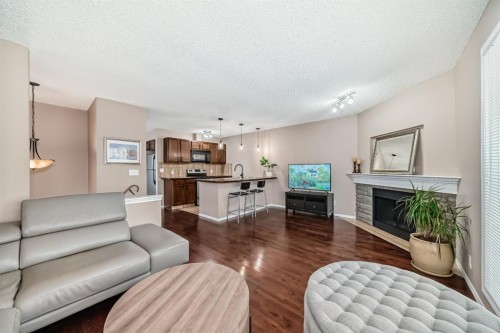 8432 Berkley Road Nw, Calgary, AB - Indoor Photo Showing Living Room With Fireplace