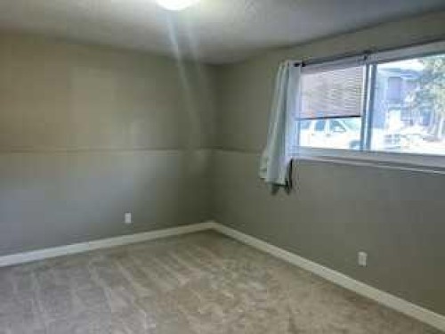 1123 Mckinnon Drive Ne, Calgary, AB - Indoor Photo Showing Other Room