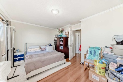 144 Taradale Drive Ne, Calgary, AB - Indoor Photo Showing Bedroom