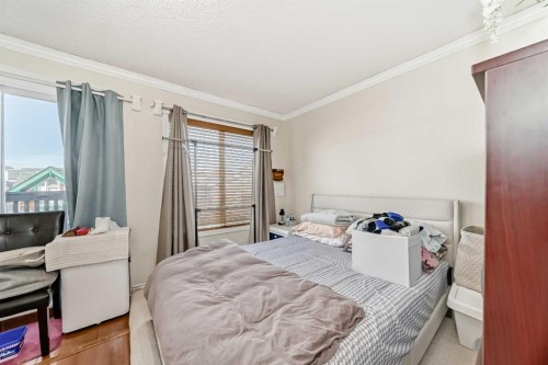 144 Taradale Drive Ne, Calgary, AB - Indoor Photo Showing Bedroom