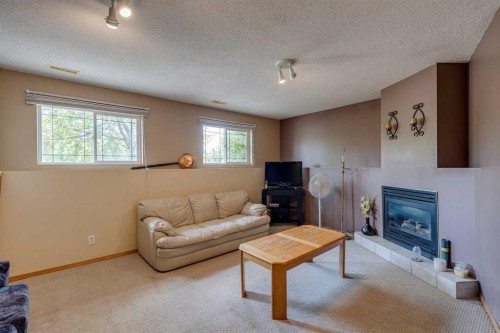 1656 Strathcona Gate, Strathmore, AB - Indoor Photo Showing Living Room With Fireplace