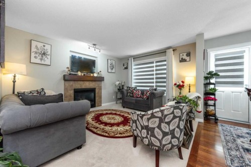 247 Taralake Way Ne, Calgary, AB - Indoor Photo Showing Living Room With Fireplace