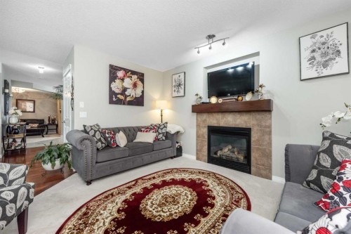247 Taralake Way Ne, Calgary, AB - Indoor Photo Showing Living Room With Fireplace