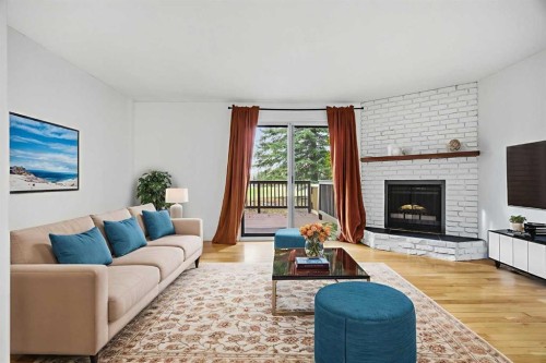 8-803 Varsity Estates Drive Nw, Calgary, AB - Indoor Photo Showing Living Room With Fireplace