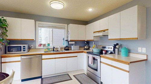 27 Hidden Valley Link Nw, Calgary, AB - Indoor Photo Showing Kitchen With Double Sink