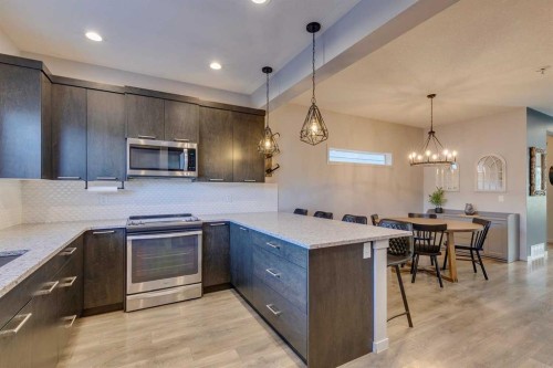 144 Masters Link Se, Calgary, AB - Indoor Photo Showing Kitchen With Stainless Steel Kitchen With Upgraded Kitchen