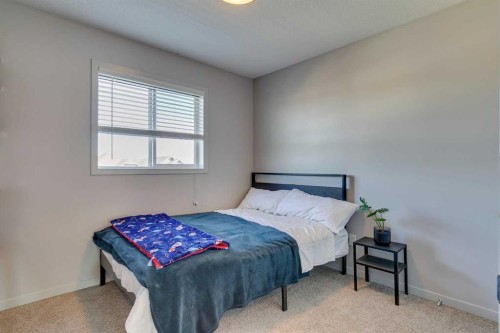 144 Masters Link Se, Calgary, AB - Indoor Photo Showing Bedroom