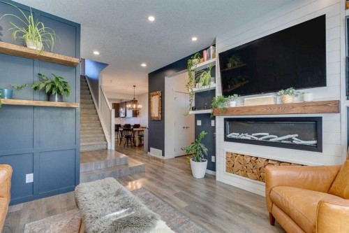 144 Masters Link Se, Calgary, AB - Indoor Photo Showing Living Room With Fireplace