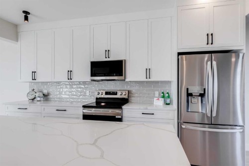 1907 Mccaskill Drive, Crossfield, AB - Indoor Photo Showing Kitchen With Upgraded Kitchen