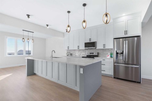 1907 Mccaskill Drive, Crossfield, AB - Indoor Photo Showing Kitchen With Upgraded Kitchen