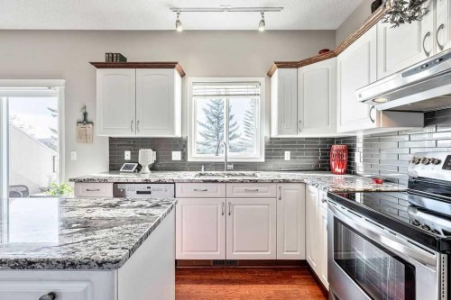 143 Country Hills Gardens Nw, Calgary, AB - Indoor Photo Showing Kitchen With Upgraded Kitchen