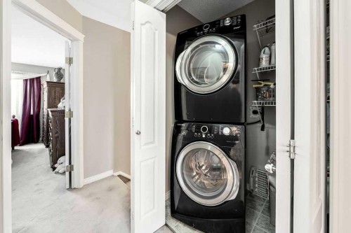 143 Country Hills Gardens Nw, Calgary, AB - Indoor Photo Showing Laundry Room