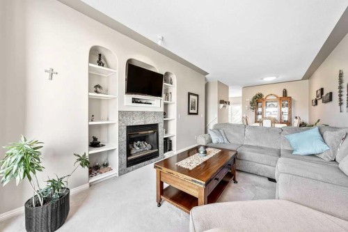143 Country Hills Gardens Nw, Calgary, AB - Indoor Photo Showing Living Room With Fireplace
