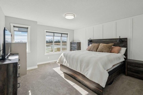 504 Creekrun Lane Sw, Airdrie, AB - Indoor Photo Showing Bedroom