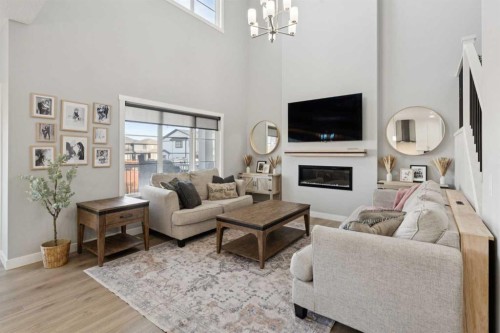 504 Creekrun Lane Sw, Airdrie, AB - Indoor Photo Showing Living Room With Fireplace