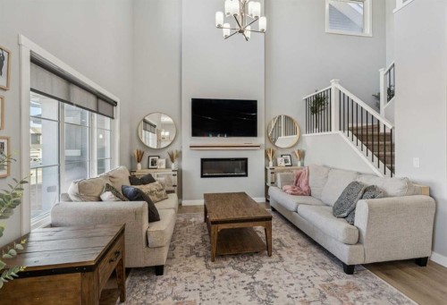 504 Creekrun Lane Sw, Airdrie, AB - Indoor Photo Showing Living Room With Fireplace