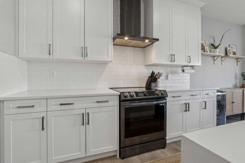 504 Creekrun Lane Sw, Airdrie, AB - Indoor Photo Showing Kitchen With Upgraded Kitchen