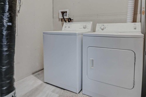 217 Somerside Close Sw, Calgary, AB - Indoor Photo Showing Laundry Room