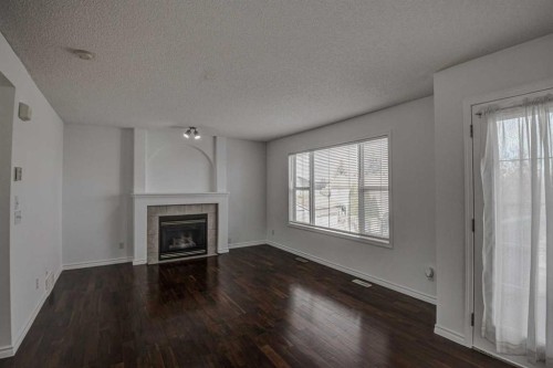 217 Somerside Close Sw, Calgary, AB - Indoor Photo Showing Living Room With Fireplace