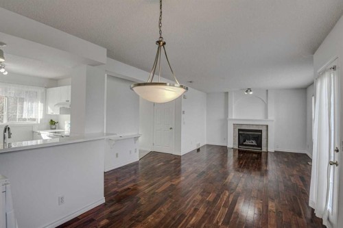 217 Somerside Close Sw, Calgary, AB - Indoor With Fireplace
