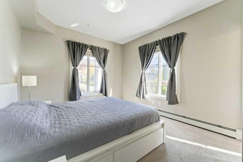 104-110 Auburn Meadows View Se, Calgary, AB - Indoor Photo Showing Bedroom