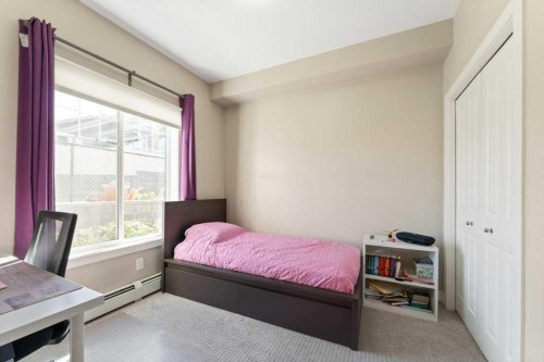 104-110 Auburn Meadows View Se, Calgary, AB - Indoor Photo Showing Bedroom