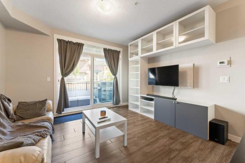 104-110 Auburn Meadows View Se, Calgary, AB - Indoor Photo Showing Living Room