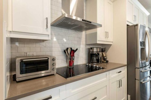 104-110 Auburn Meadows View Se, Calgary, AB - Indoor Photo Showing Kitchen With Upgraded Kitchen